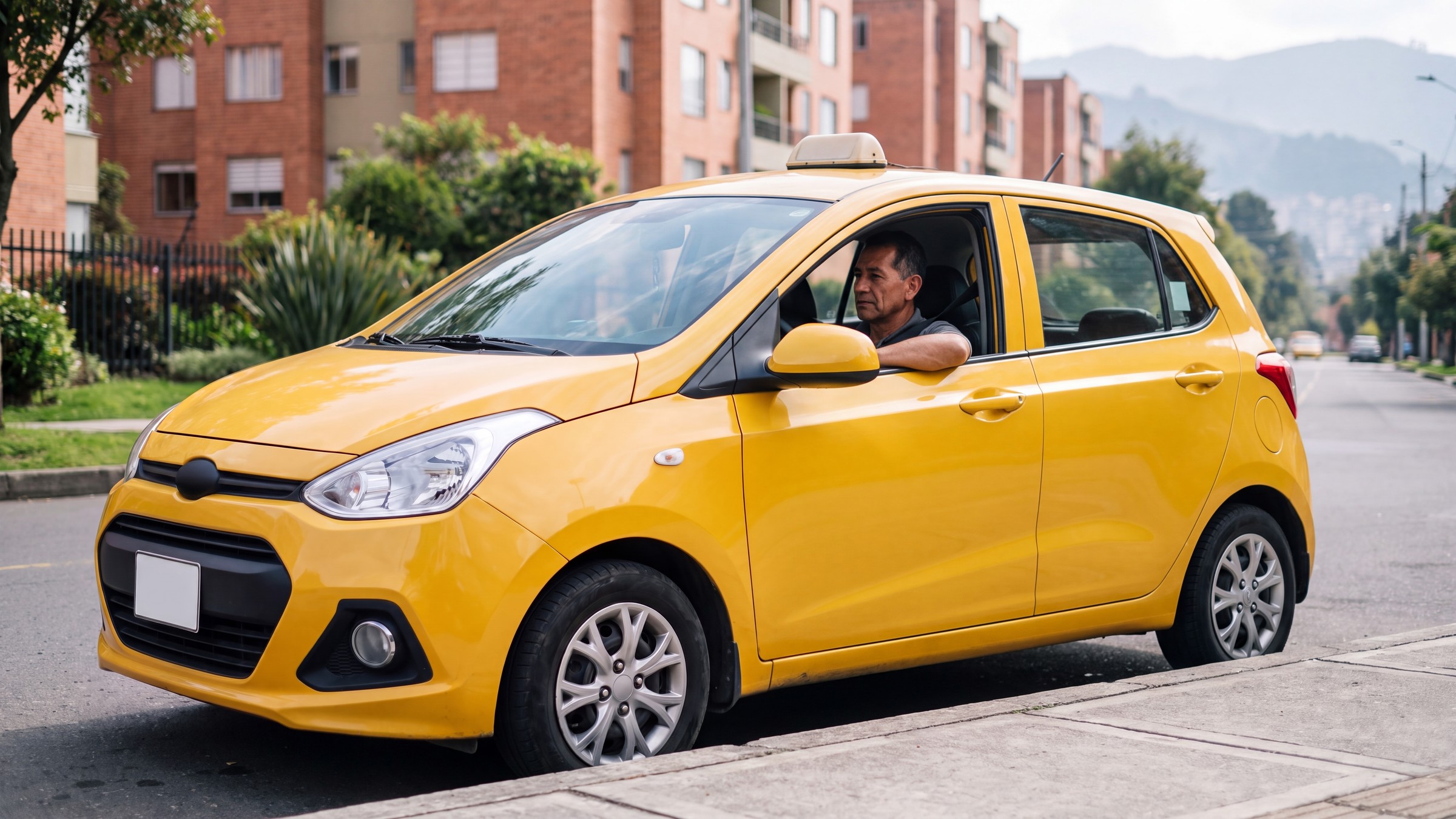 Taxi amarillo detenido en una calle arborizada de Bogotá, con el conductor al volante y el cinturón puesto